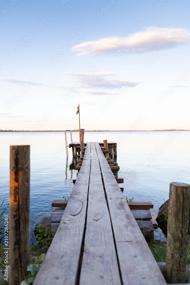 Fototapeta premium wooden pier on a lake serene summer