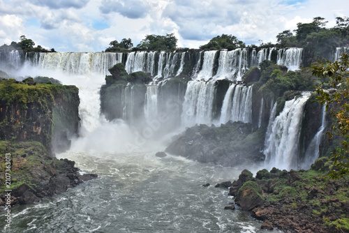 Iguazu Falls, view from Argentina side. Place where Iguazu River splits into two streams. It flows between the Argentine and Brazilian sides. The Largest waterfall system in the world, UNESCO World He