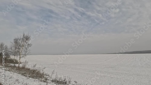 Along the road, winter roadside view, view from the car window. Snow winter day.	