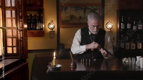 Saloon keeper loading pistol