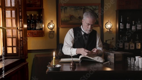 Saloon Keeper bags money and stores in box