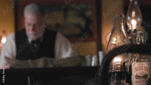 Saloon Keeper Reading focus on foreground objects