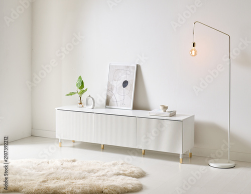 Modern White Fluted TV Stand Cabinet in Bright Minimalist Living Room Interior
