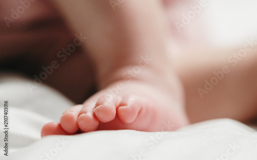 Принти на полотні A close-up portrait of the cute toes on the foot of a sleeping Caucasian newborn baby