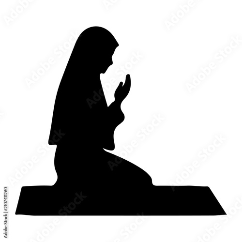 Фотография Silhouette of a Woman Praying in Meditation Position.