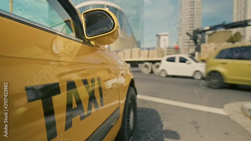 A taxi is about to cross