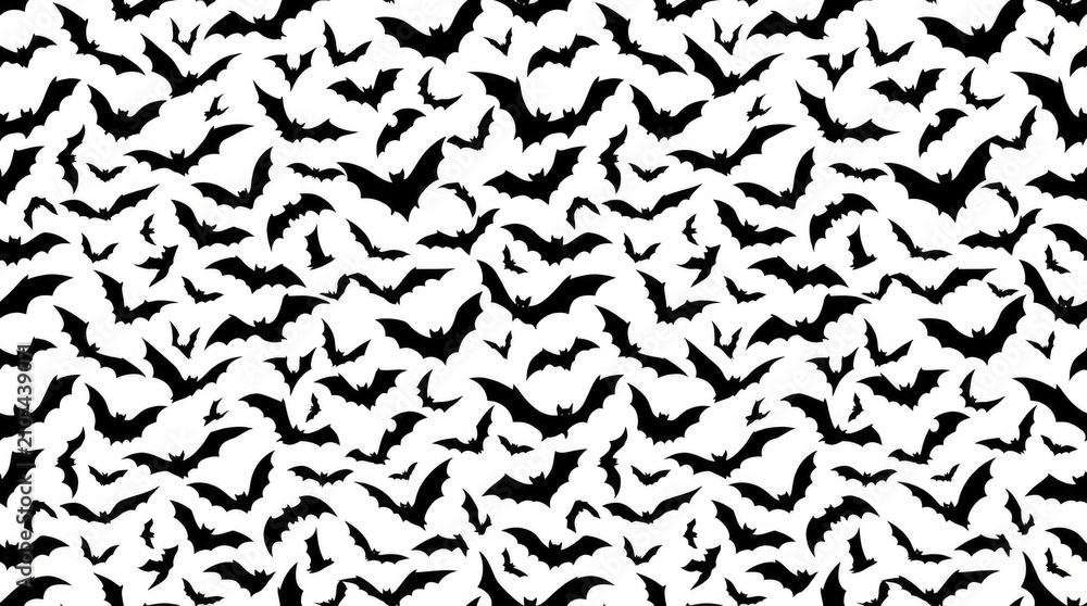 Seamless pattern featuring many small black bats flying across a bright clean white background space