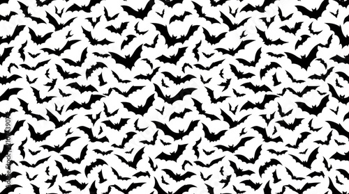 Seamless pattern featuring many small black bats flying across a bright clean white background space