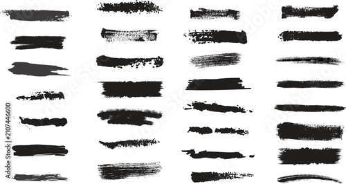 Set of black ink brush strokes and paint marks isolated on white background