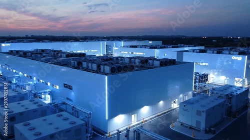 Aerial view of modern data center campus at dusk, cloud computing infrastructure
