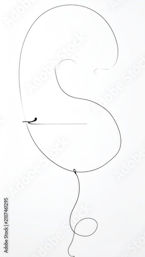 Abstract wispy strand forms a graceful loop against a stark white background