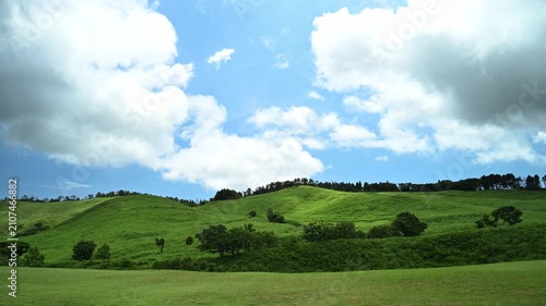 Timelapse footage of white clouds over green mountain plateau, Izu Peninsula