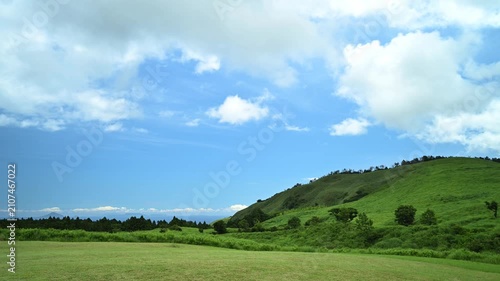 Timelapse footage of white clouds over green mountain plateau, Izu Peninsula