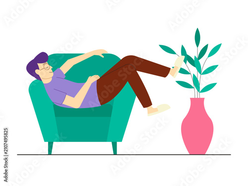 Foto A lazy man lounging on a teal sofa