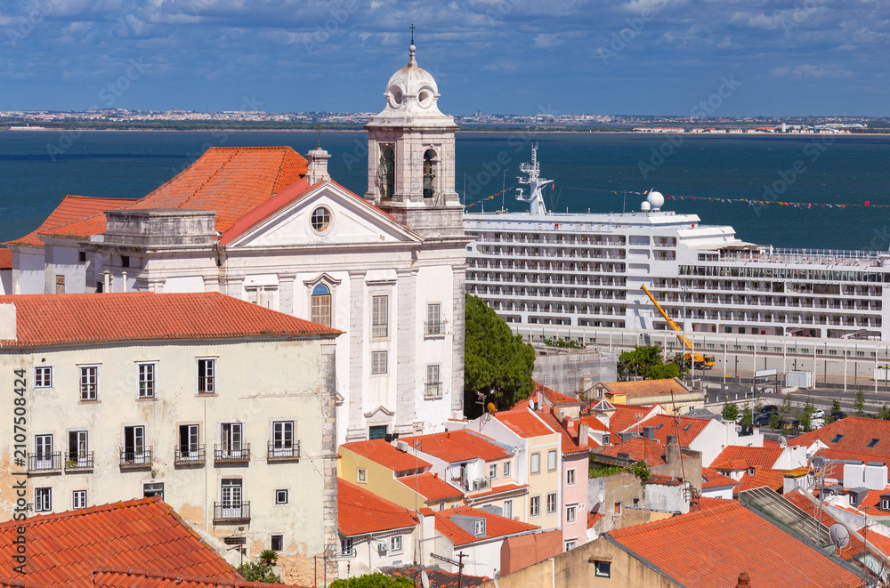 Fototapeta premium Historic church and cruise ship on the Tagus River in Lisbon, Portugal