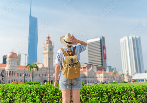 Photography Female tourist in hat with backpack in Kuala Lumpur, Malaysia