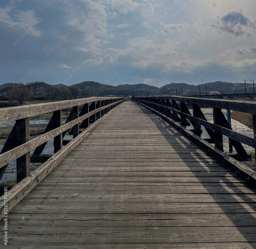 Naklejka premium wooden bridge over the sea