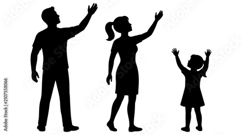 Black silhouettes of a happy family including a man woman and child raising their arms towards the sky in prayer and hope