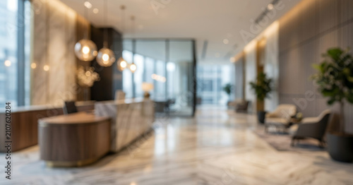 Fully blurred luxury corporate reception lobby with elegant marble flooring, modern reception desk, ambient lighting sophisticated architecture and premium business background with generous copy space