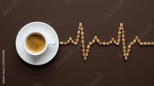 Rich espresso cup next to heart rate pulse line made of golden roasted coffee beans on a dark brown background, symbolizing energy caffeine boost and health vitality for a productive morning routines.