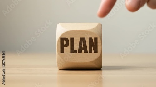 Strategic Plan Concept with Wooden Cube in Focus.