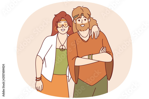Schilderij op canvas Hippie man and woman stand in embrace and smile, rejoicing at presence of free youth subculture