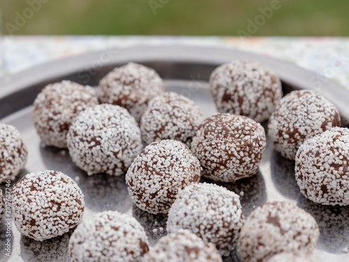 Fotografie Homemade Swedish chocolate balls coated in pearl sugar and served on a metal tray