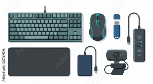 A flat lay of computer hardware and digital peripherals is arranged neatly on a white.