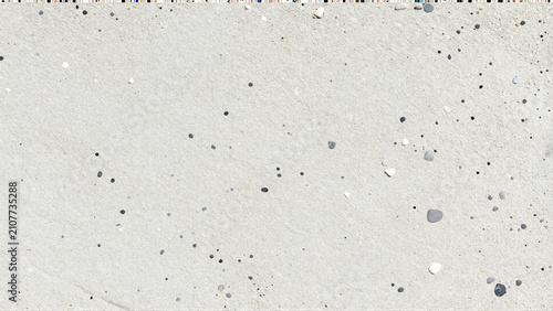 High Resolution Texture of Fine White Beach Sand with Small Dark Pebbles and Grains