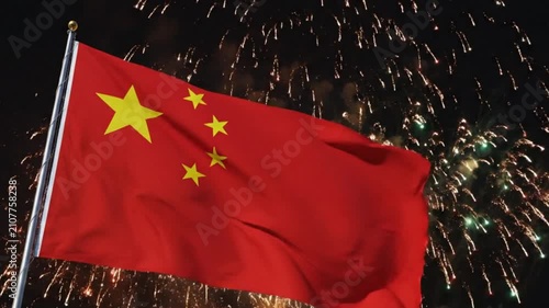 Chinese National Flag Waving Against Fireworks at Night