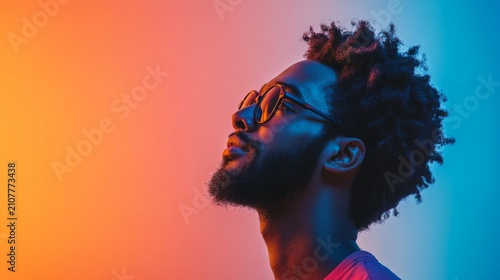Profile of a young man, glasses, colorful background