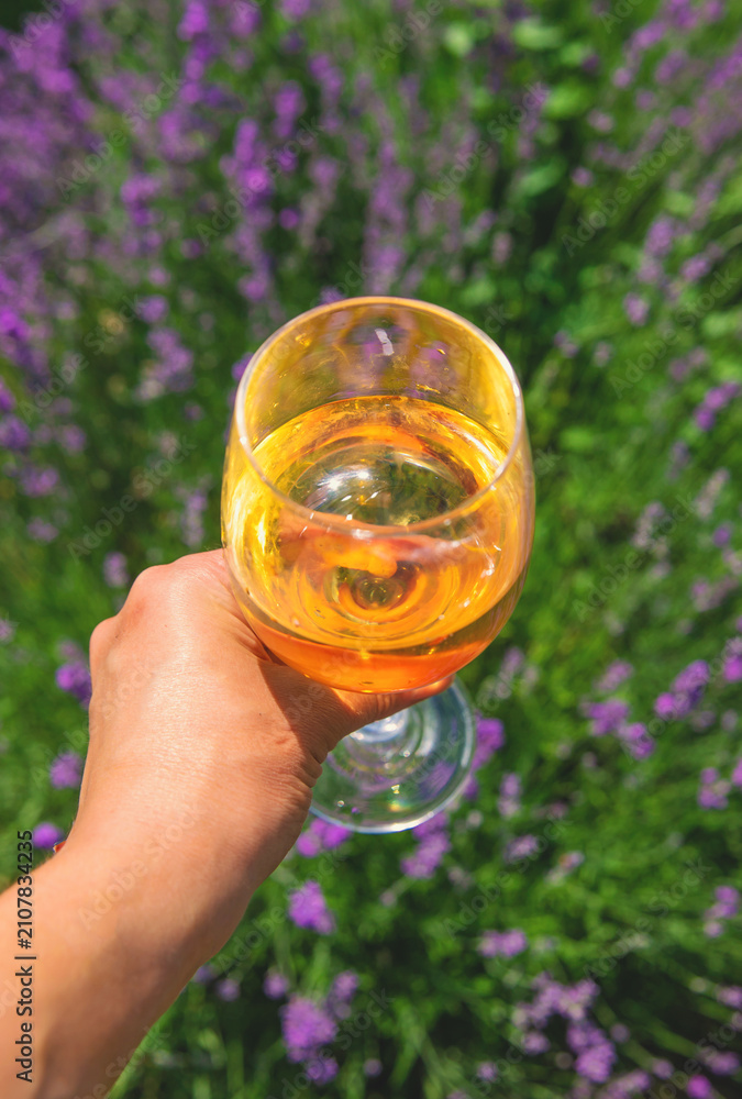 Obraz premium Wine in a lavender field. Selective focus.