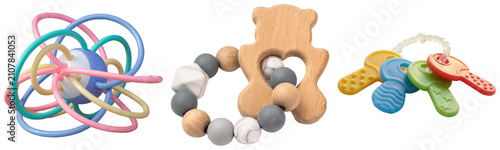 Bild auf Leinwand Set of three baby teething toys: a colorful flexible ball, a wooden bear with be