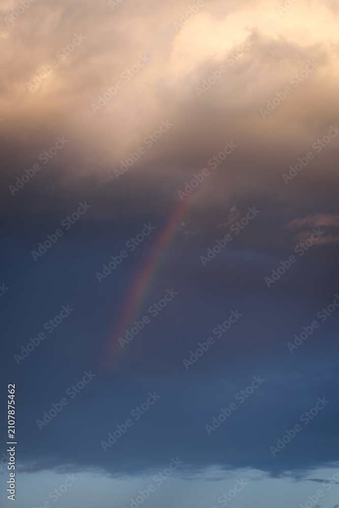 Fototapeta premium Vertical Stormy Sunset Sky with Rainbow for Sky Replacement