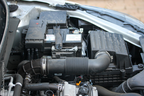 Oblique view of a new budget vehicle battery and air intake system