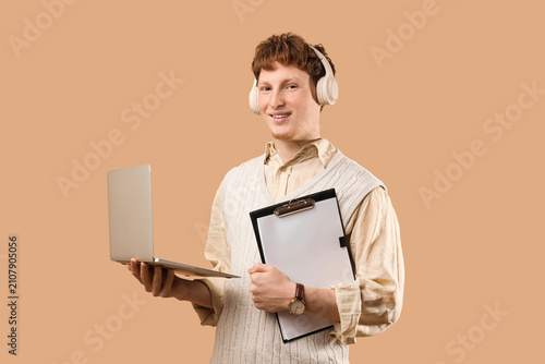 Young man in headphones wit...