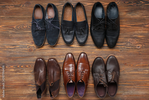 Different shoes on wooden b...