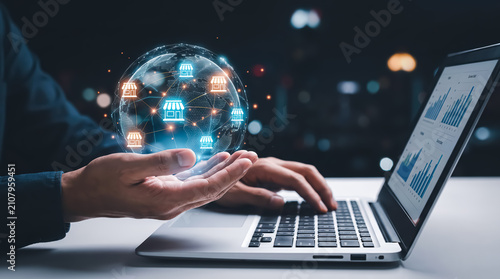 Businessman holding a digital globe with store icons, representing global retail network, ecommerce, and business expansion