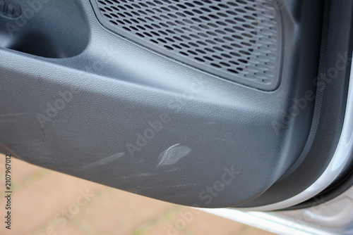 Scuff marks on the door pocket of a new car