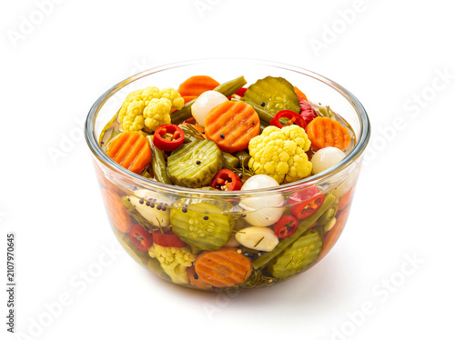 A vibrant bowl of assorted pickled vegetables including carrots, cucumbers, and cauliflower, isolated on white background, showcasing a colorful and appetizing arrangement of preserved produce