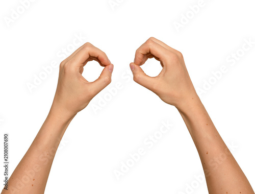 Two hands forming circular shapes like binoculars. Woman s arms raised making round frames near each