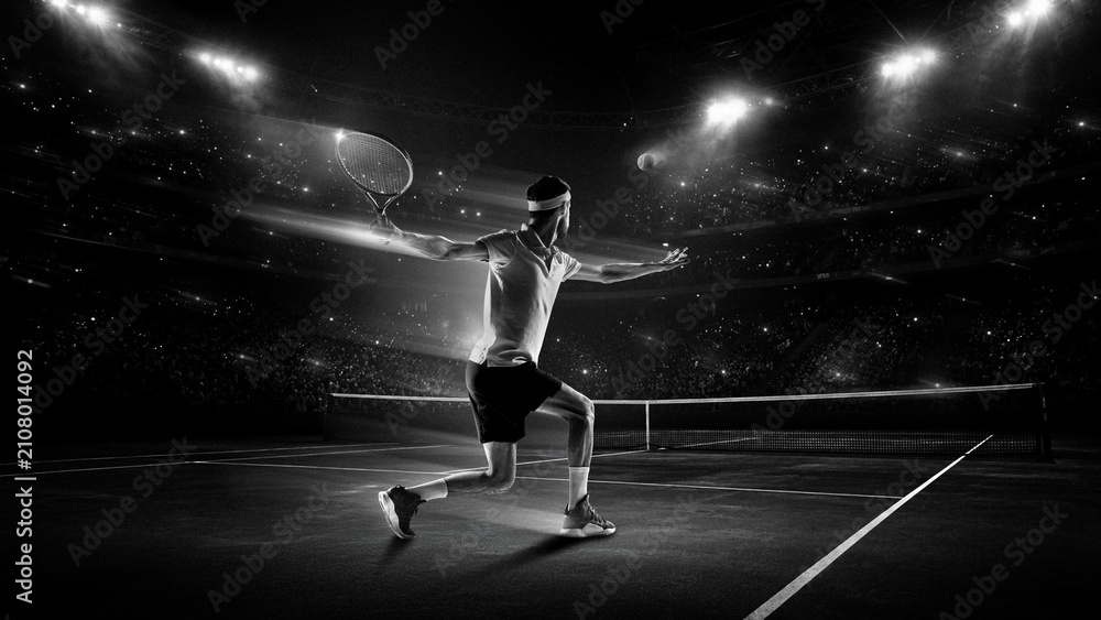 Fototapeta premium Professional male tennis player sprinting for shot in black and white stadium. Concept of sports media promotion, performance footwear marketing, professional competition branding. Motion blur effect