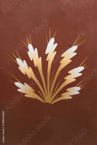 Stylized gold leaf burst on warm terracotta background for elegant wallpaper and poster design
