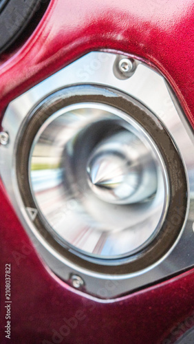 Bilde på lerret Automotive sound system speaker detail, vibrant red car interior panel, modern audio equipment installation, custom vehicle tuning component close-up, high fidelity sound reproduction