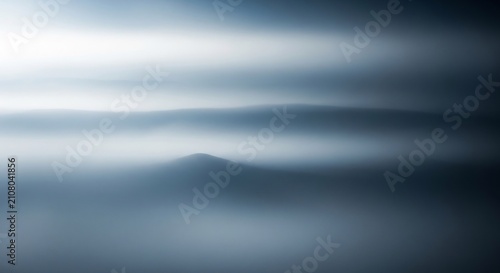 Abstract Mountain Peak Emerging Through Misty Foggy Landscape.