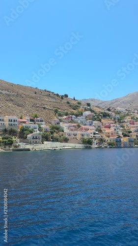 Deep blue Mediterranean sea stretching to the horizon, crystal-clear water, gentle ripples, bright sunshine, peaceful coastal landscape