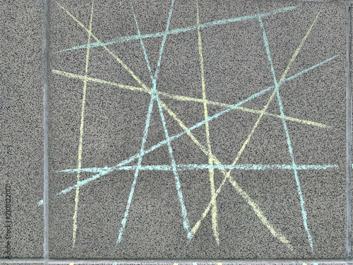 Abstract background of geometric intersecting straight chalk lines and grid pattern on a grey granite stone tile.