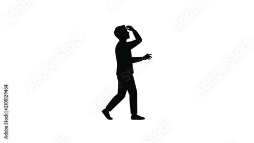 Silhouette of a person walking with headphones on.