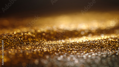 Sparkling Gold Glitter Texture Background Close Up.