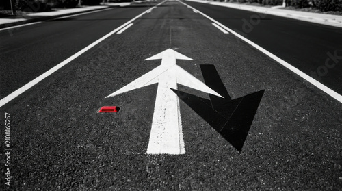 Directional Arrows On Asphalt Road